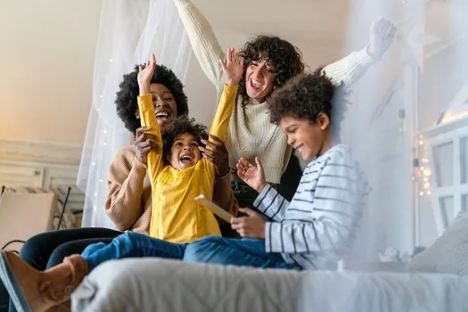 Joyful modern family laughing together