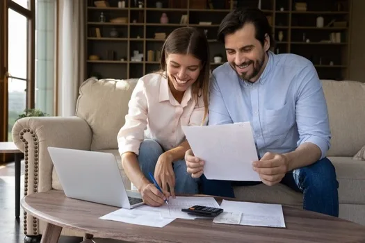 Couple reviewing finances together at home